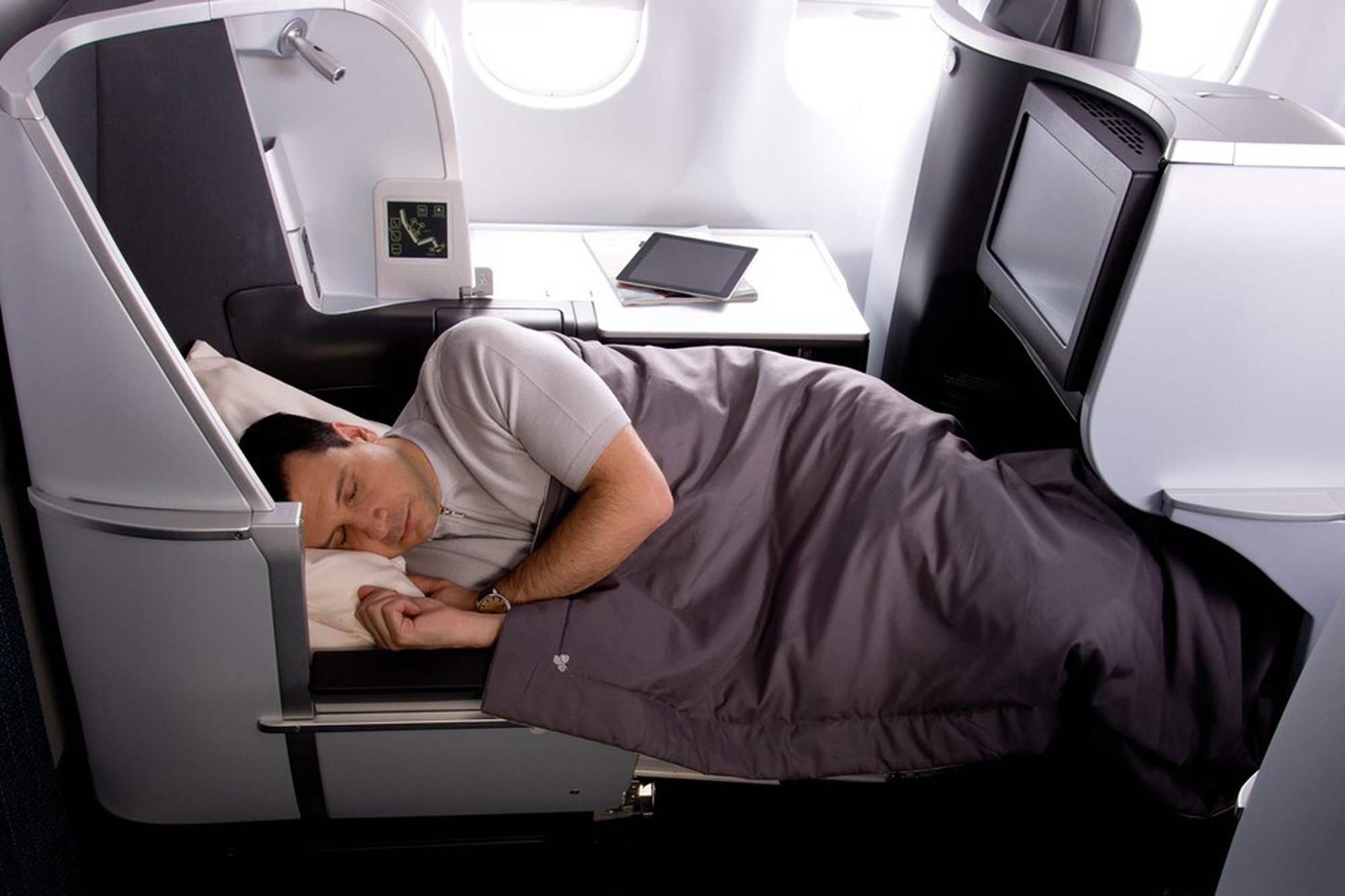 Lie-flat bed in Aer Lingus Business Class ensures restful sleep on long-haul flights with full bedding provided. Photo by Aer Lingus.