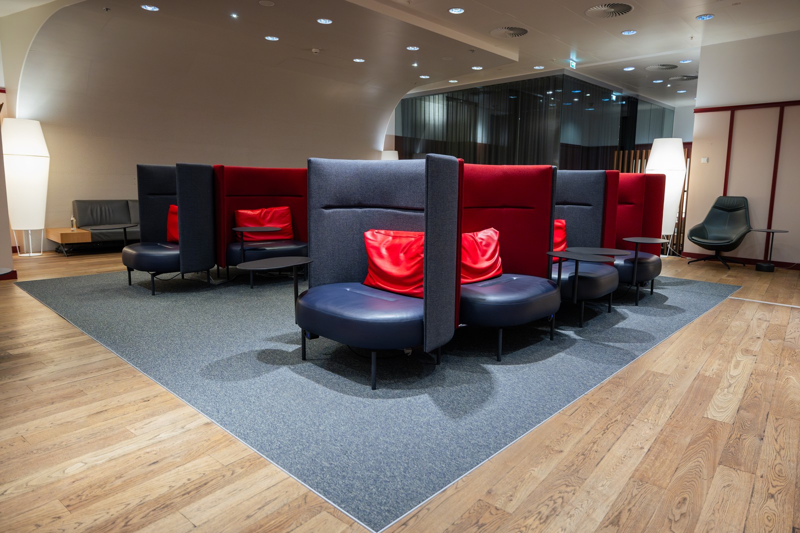Cozy and stylish lounge chairs in the Austrian Airlines Business Lounge at Vienna Airport, offering privacy and comfort before departure. Photo by Austrian Airlines.
