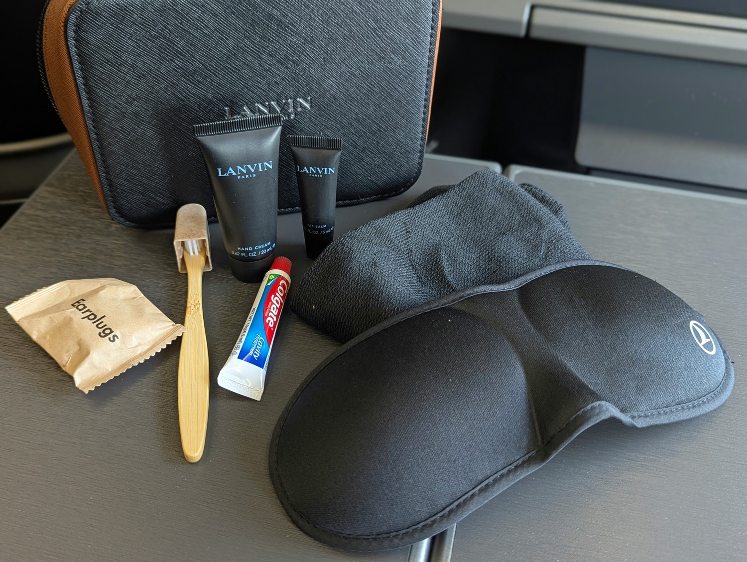 Business Class amenity kit by Lanvin, including skincare products, sleep mask, and travel essentials. Photo by Frugal Flyer.