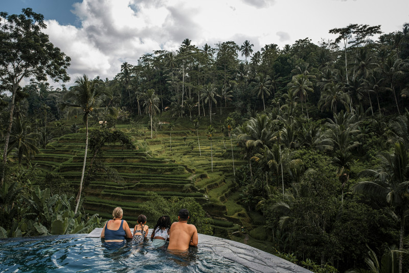 Relaxing in a stunning infinity pool overlooking the iconic tegallalang rice terraces