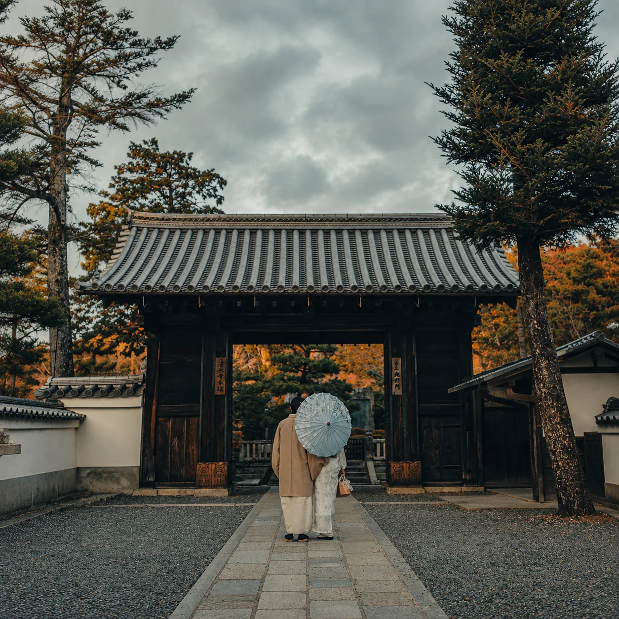 Visitors at a temple gate in Kyoto..png
